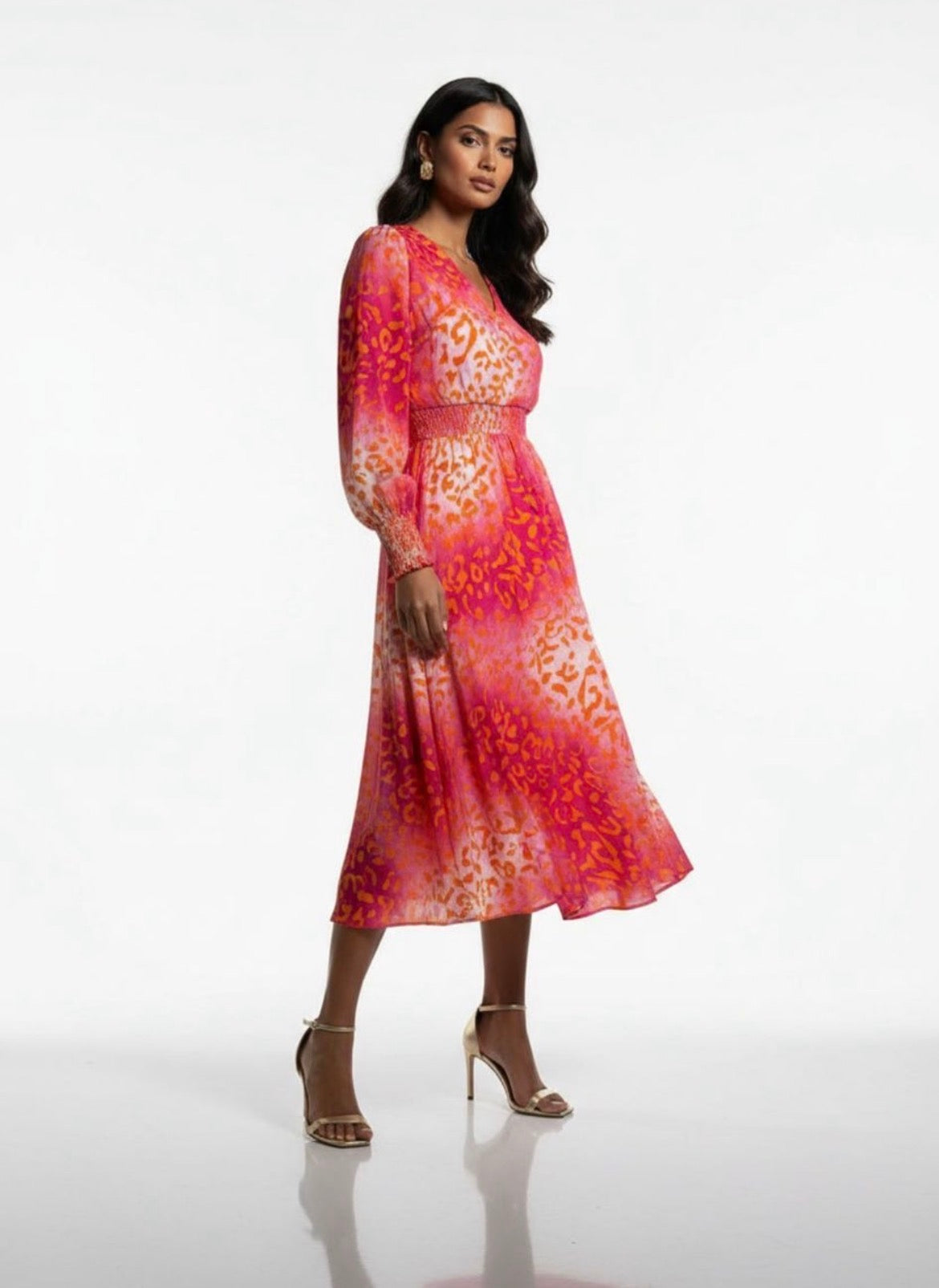 Woman wearing a red Dex Print Dress on a white background