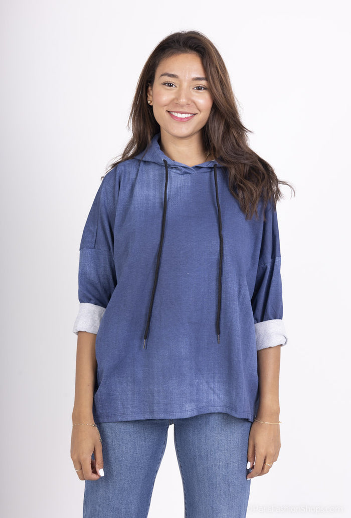 Woman wearing a blue hoodie and jeans on a white background 'Harriett Denim Hoody Picture "