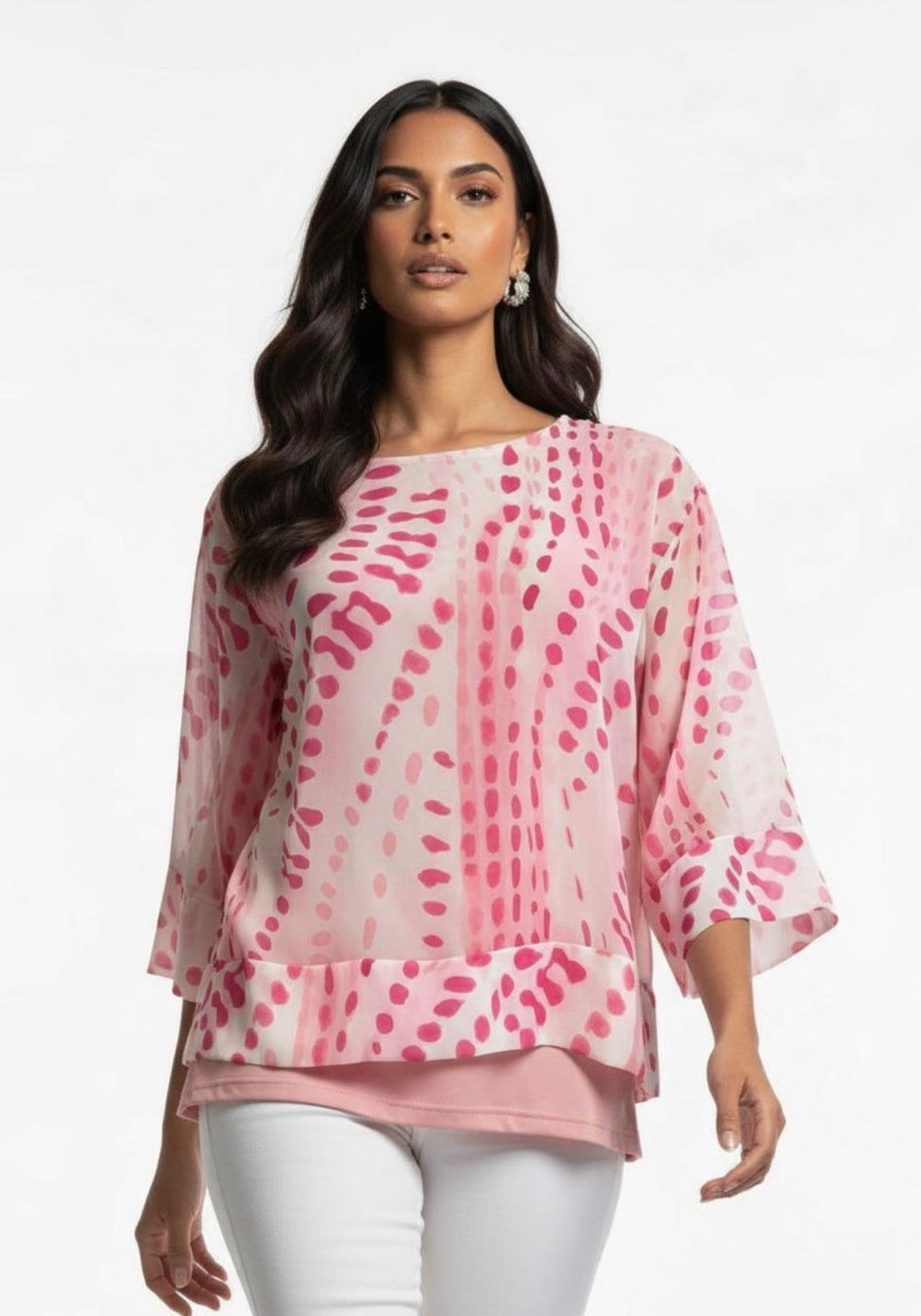 Woman wearing a pink patterned blouse with white pants on a light gray background Kayla Print Top