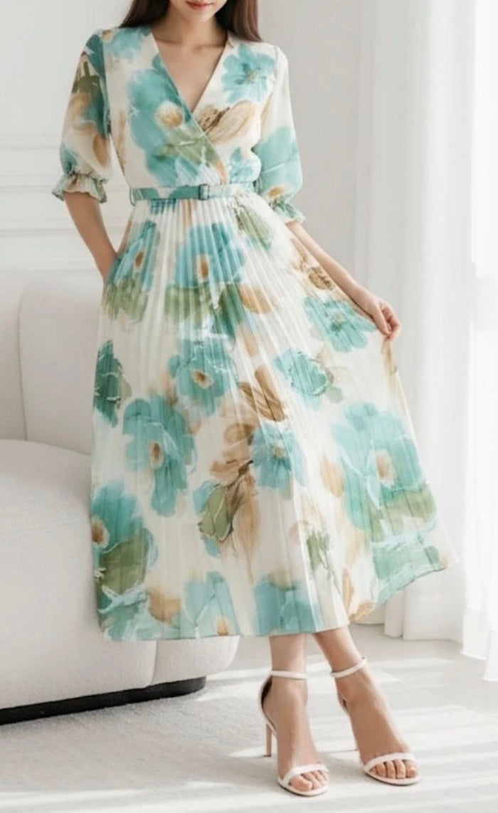 Woman wearing a Lisa Pleated Dress with a neutral background