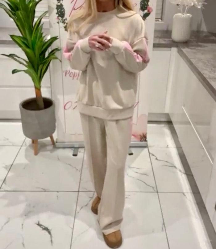 Person wearing a Melissa_Lounge_Set in a modern kitchen setting