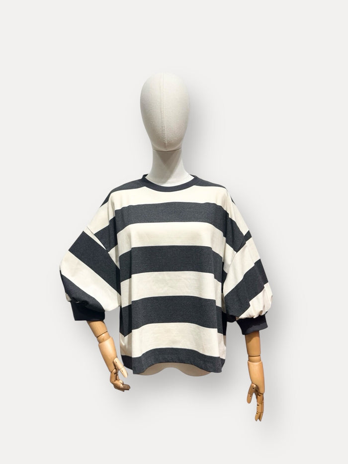 Mannequin wearing a black and white striped sweater on a white background "Muireann Stripe Top"