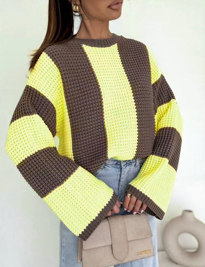 Person wearing a yellow and brown Noeleen Stripe Knit with a neutral background